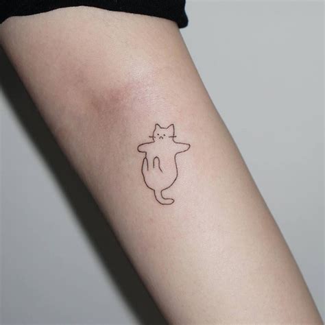 cat lining tattoo